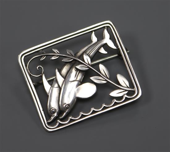 A Danish Georg Jensen sterling silver rectangular leaping dolphin brooch, no. 251, 36mm.